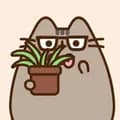 Pusheen eating plant